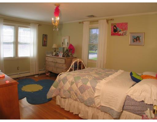 123 Johnson Road Winchester, MA 01890 - Photo 9 of 12 a bedroom with a bed dresser and window