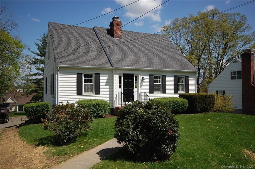 71 Prospect Street Ridgefield, CT 06877 - Photo 1 of 1 a front view of a house with a yard