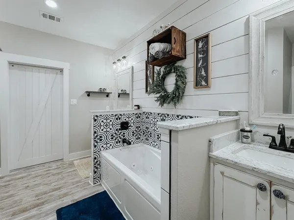 a bathroom with a sink and a mirror