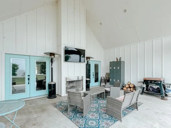 a living room with furniture a table and chairs