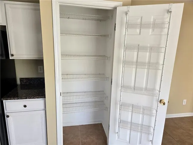 a bathroom with a shower curtain and sink