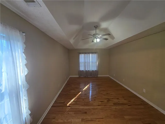 a bathroom with a sink a large mirror and a bathtub