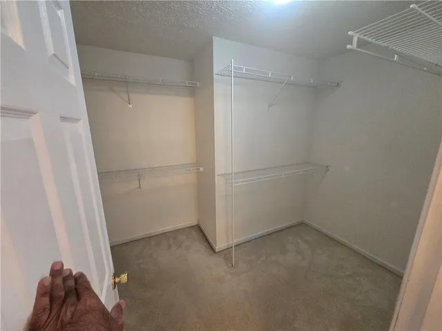 a view of an empty walk in closet