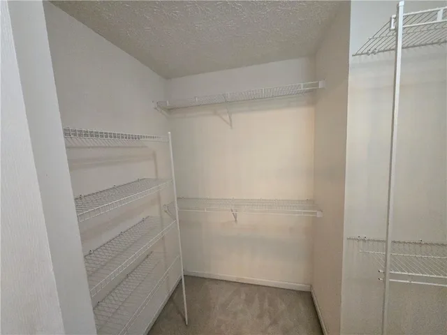 a bathroom with a sink a toilet and a shower