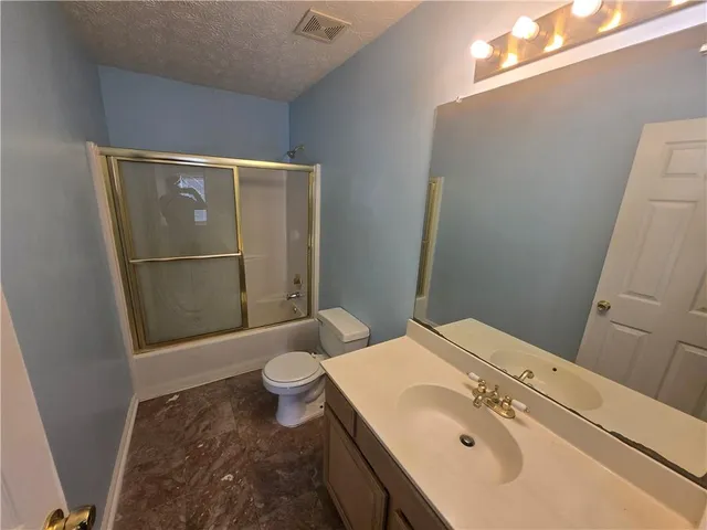 a view of empty room with windows