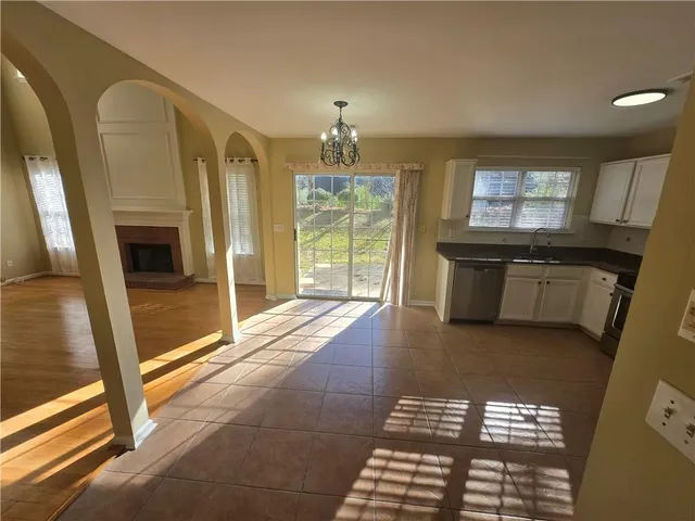a living room with furniture window and flat screen tv