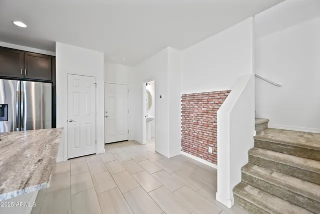 a kitchen with granite countertop a stove and a sink