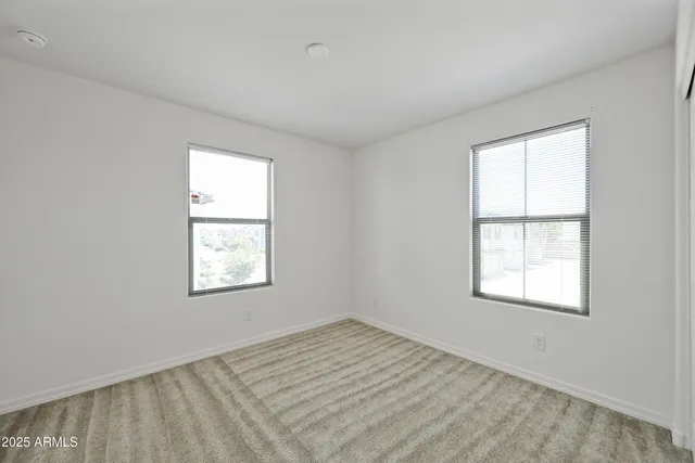 a bathroom with a double vanity sink mirror and shower