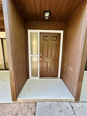 an entryway view with wooden floor