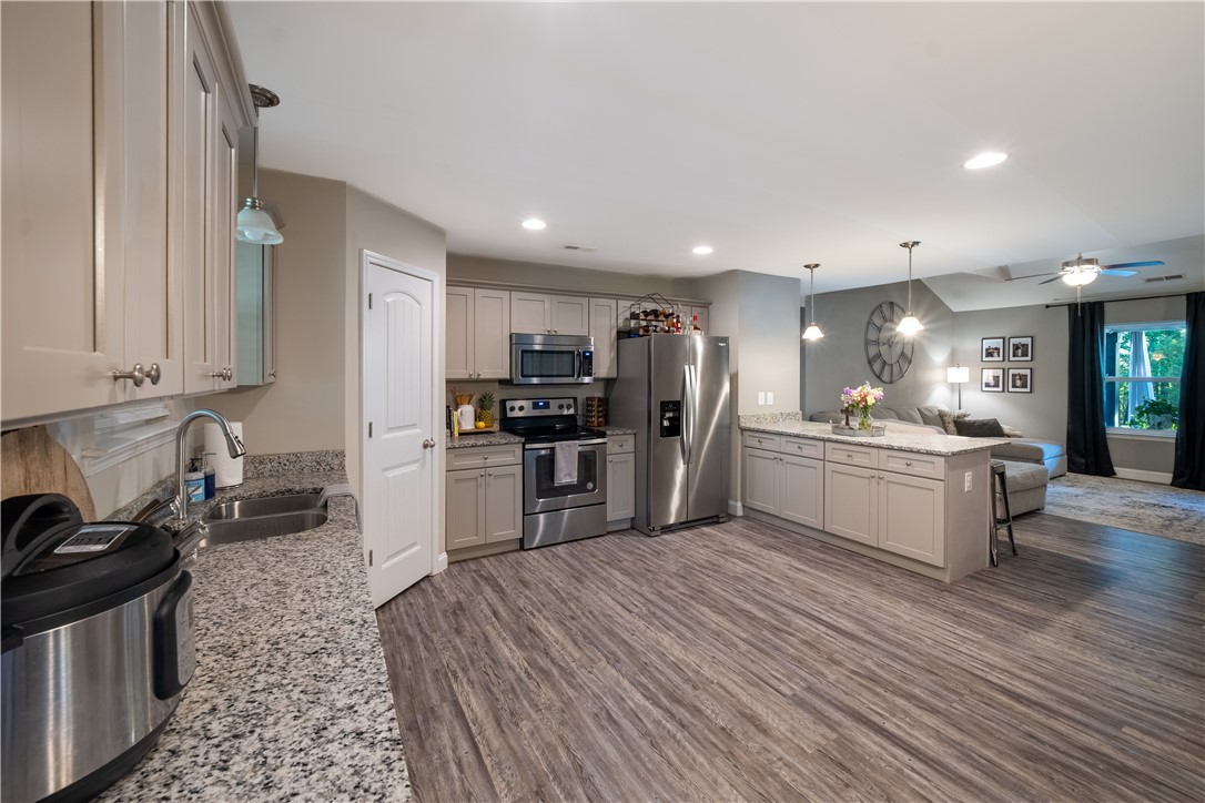 400 Green View Court Westminster, SC 29693 - Photo 14 of 23 This open concept kitchen features abundant cabinetry and a spacious island, perfect for entertaining.