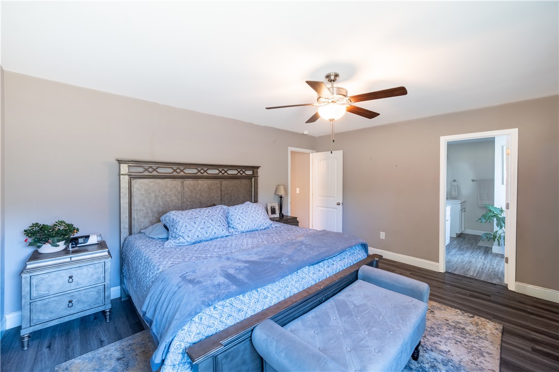 400 Green View Court Westminster, SC 29693 - Photo 16 of 23 This primary bedroom offers a private retreat with elegant flooring and a connecting bathroom.