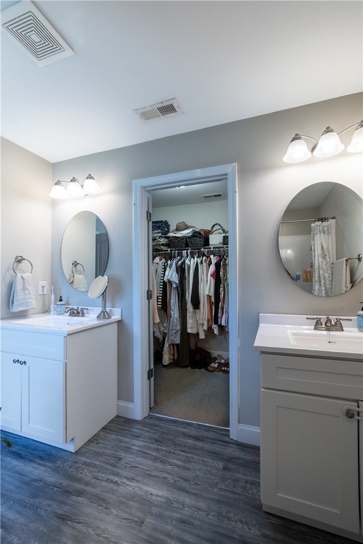 400 Green View Court Westminster, SC 29693 - Photo 18 of 23 This spacious bathroom offers dual vanities and direct access to a well-organized walk-in closet.