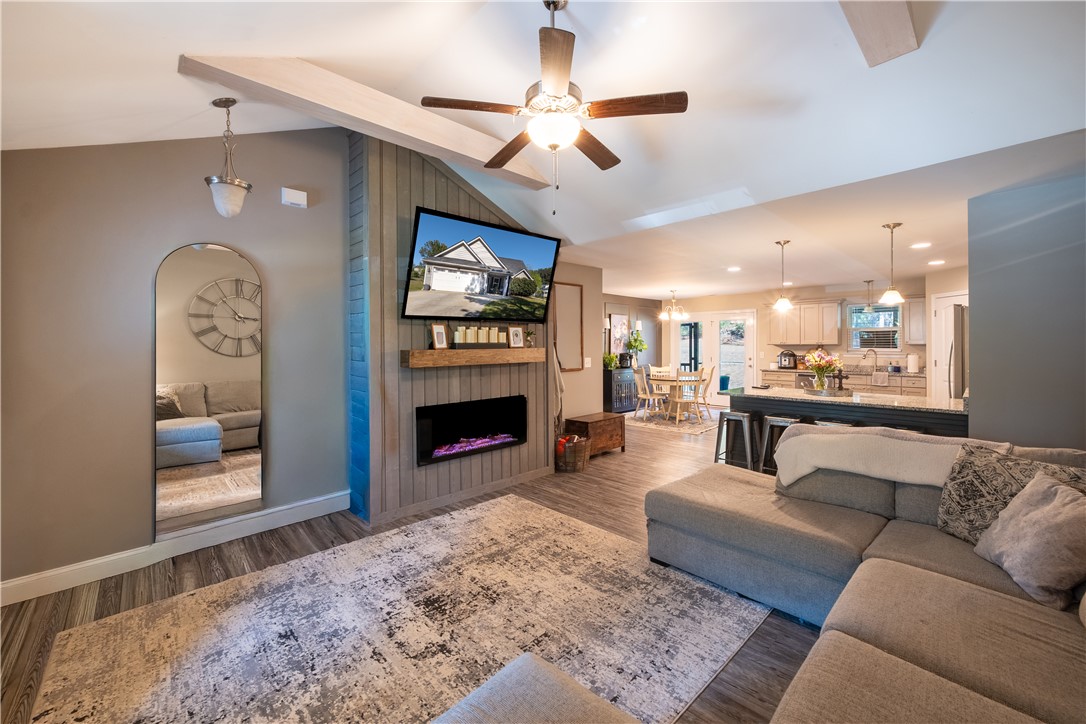 400 Green View Court Westminster, SC 29693 - Photo 6 of 23 An inviting open-concept living area seamlessly connects to the kitchen and dining space.