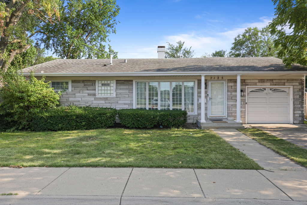 7125 Simpson Street Morton Grove, IL 60053 - Photo 1 of 33 a view of a house with a yard