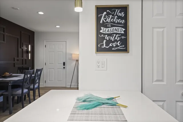 a kitchen with a sink stainless steel appliances and white cabinets