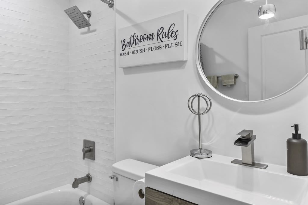 7125 Simpson Street Morton Grove, IL 60053 - Photo 14 of 33 a bathroom with a sink and a mirror