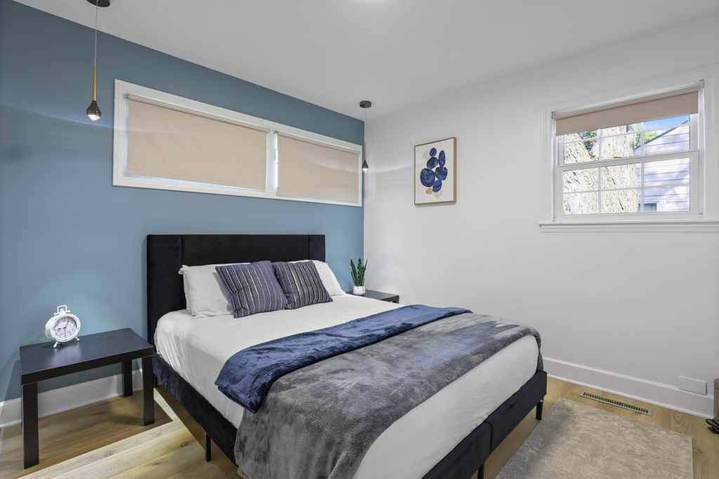 7125 Simpson Street Morton Grove, IL 60053 - Photo 15 of 33 a bed sitting in a bedroom next to a window