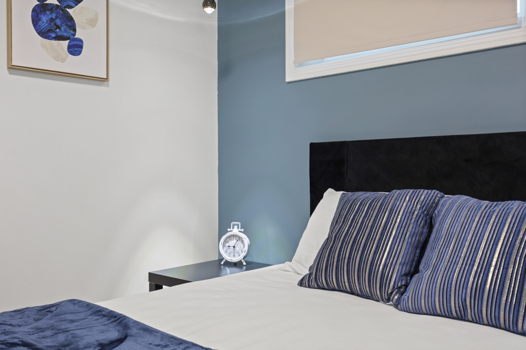 7125 Simpson Street Morton Grove, IL 60053 - Photo 16 of 33 a bedroom with a bed and wooden floor