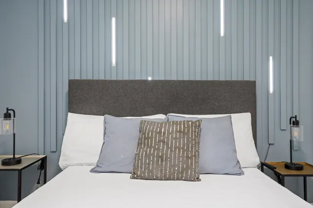 a bedroom with bed and window