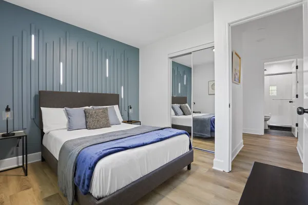 a bedroom with a bed and a window