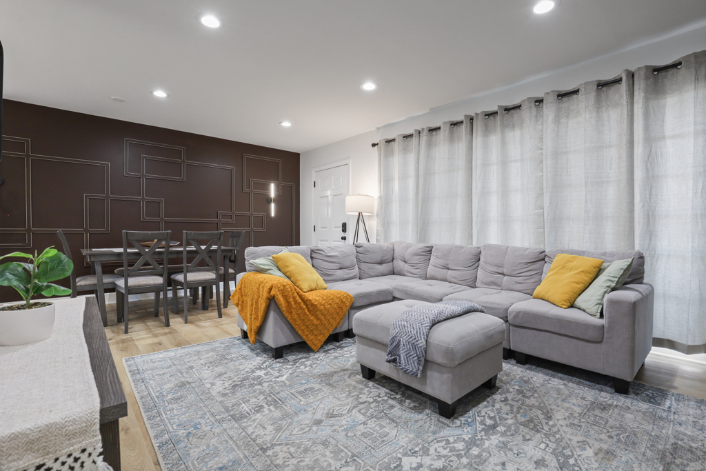 7125 Simpson Street Morton Grove, IL 60053 - Photo 2 of 33 a living room with furniture and wooden floor