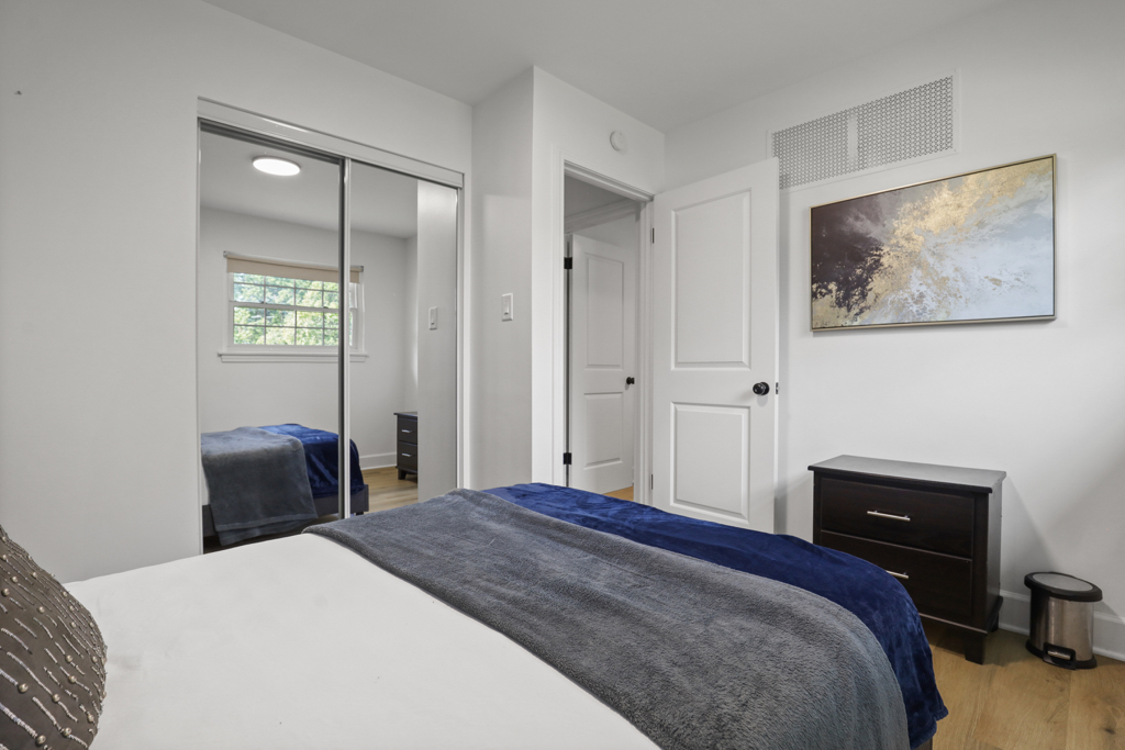 7125 Simpson Street Morton Grove, IL 60053 - Photo 21 of 33 a bedroom with a bed and a painting on the wall