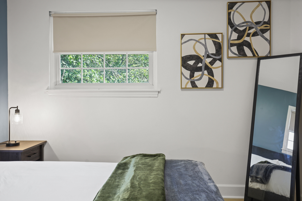 7125 Simpson Street Morton Grove, IL 60053 - Photo 24 of 33 a bedroom with a bed and a window