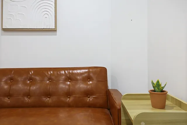 a bedroom with a bed and a lamp