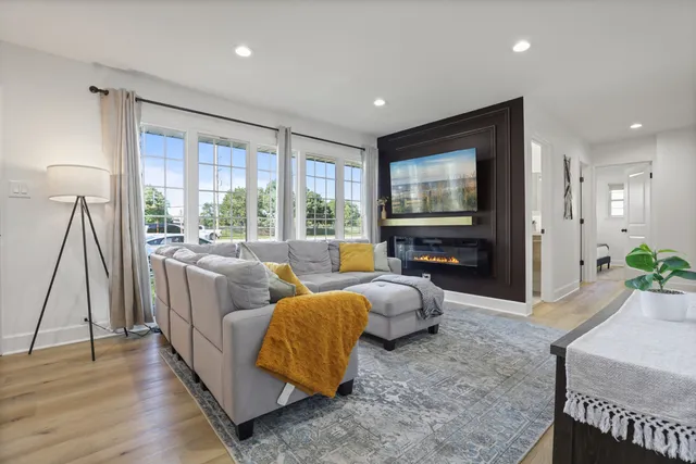 a living room with furniture and a flat screen tv