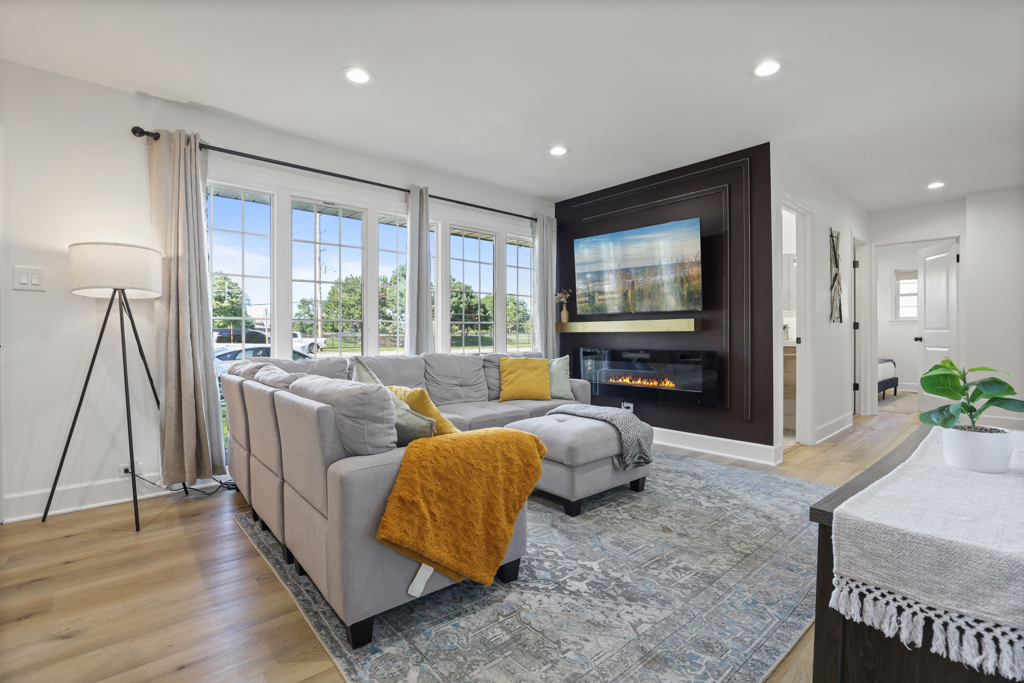 7125 Simpson Street Morton Grove, IL 60053 - Photo 3 of 33 a living room with furniture and a flat screen tv