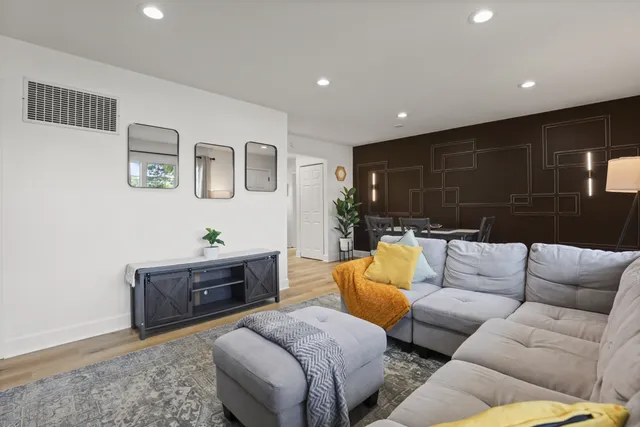 a living room with furniture and a couch