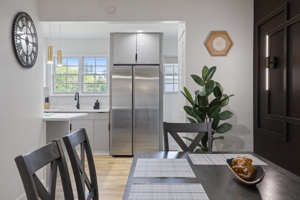 7125 Simpson Street Morton Grove, IL 60053 - Photo 9 of 33 a view of a kitchen with fridge and window