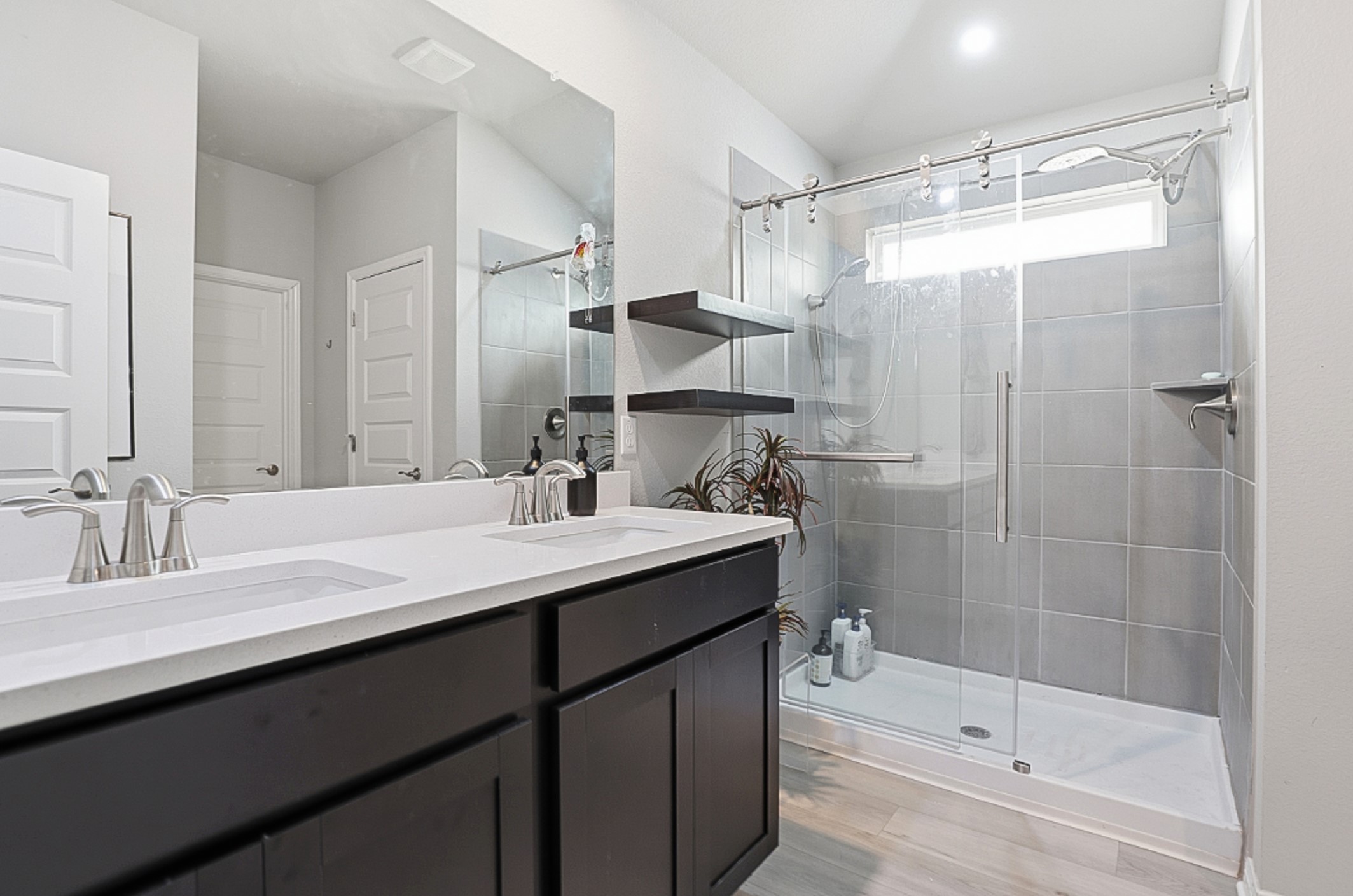 12206 Purple Prairie Lane Buda, TX 78610 - Photo 11 of 24 The oversized walk-in shower is equipped with dual shower heads.