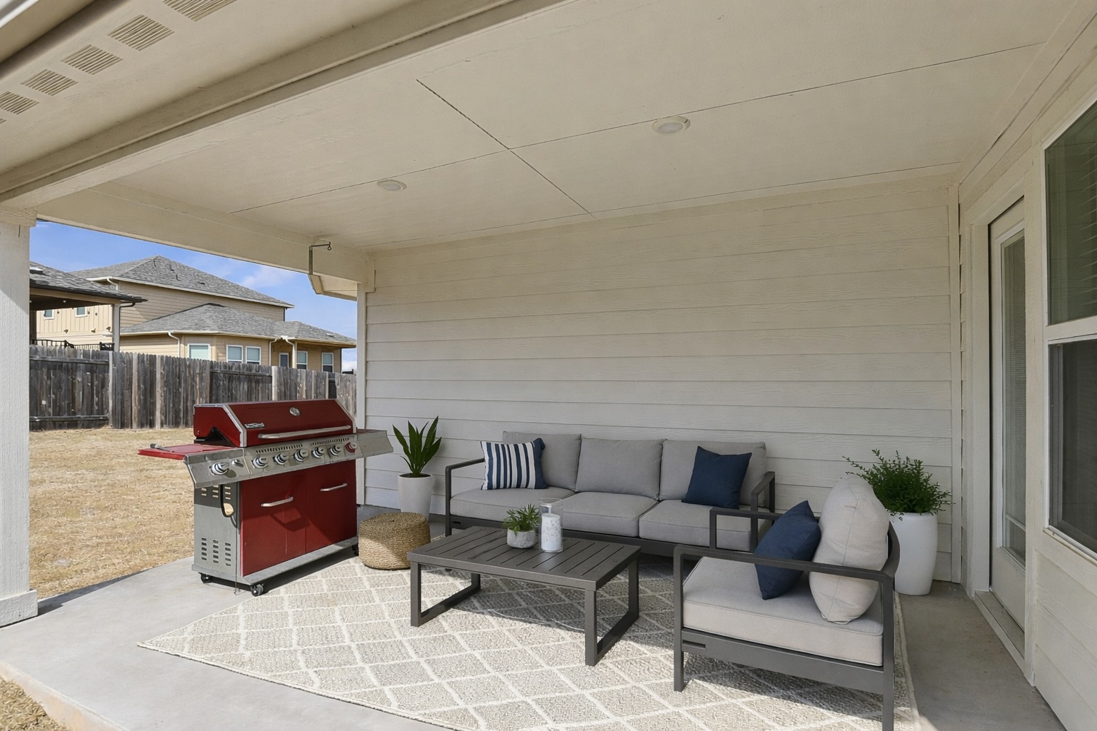 12206 Purple Prairie Lane Buda, TX 78610 - Photo 19 of 24 As we approach warm weather, the patio beckons for lounging, al fresco dining, and weekend barbecues! *Virtually Staged*