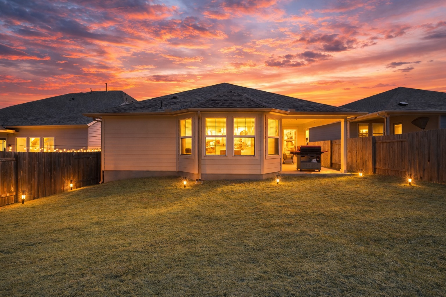 12206 Purple Prairie Lane Buda, TX 78610 - Photo 20 of 24 Enjoy cozy evenings entertaining in your backyard.