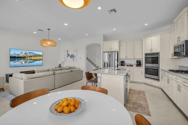 a bathroom with a granite countertop sink mirror and shower