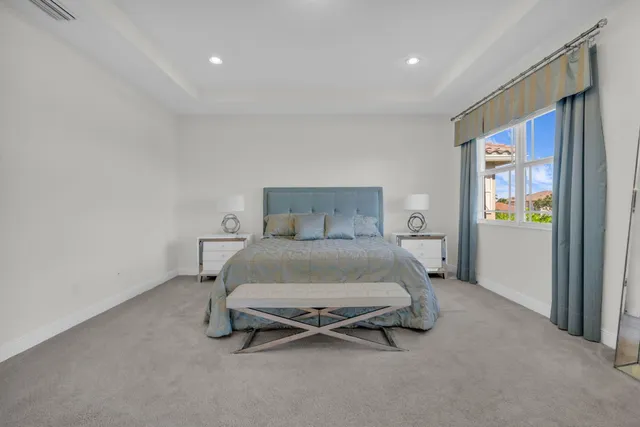 a living room with furniture and a chair