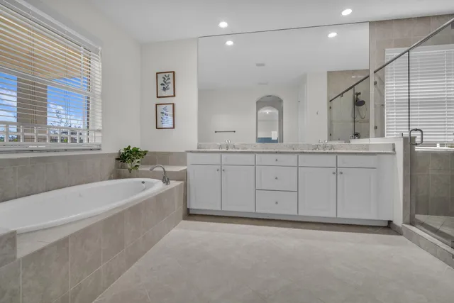 a bathroom with a granite countertop sink mirror and double