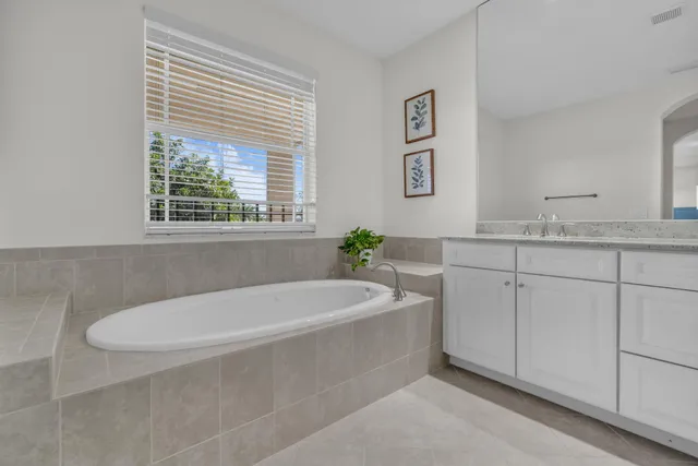 a view of a golf course with a lake view