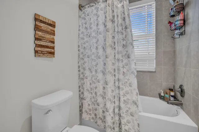 a view of a swimming pool with a yard