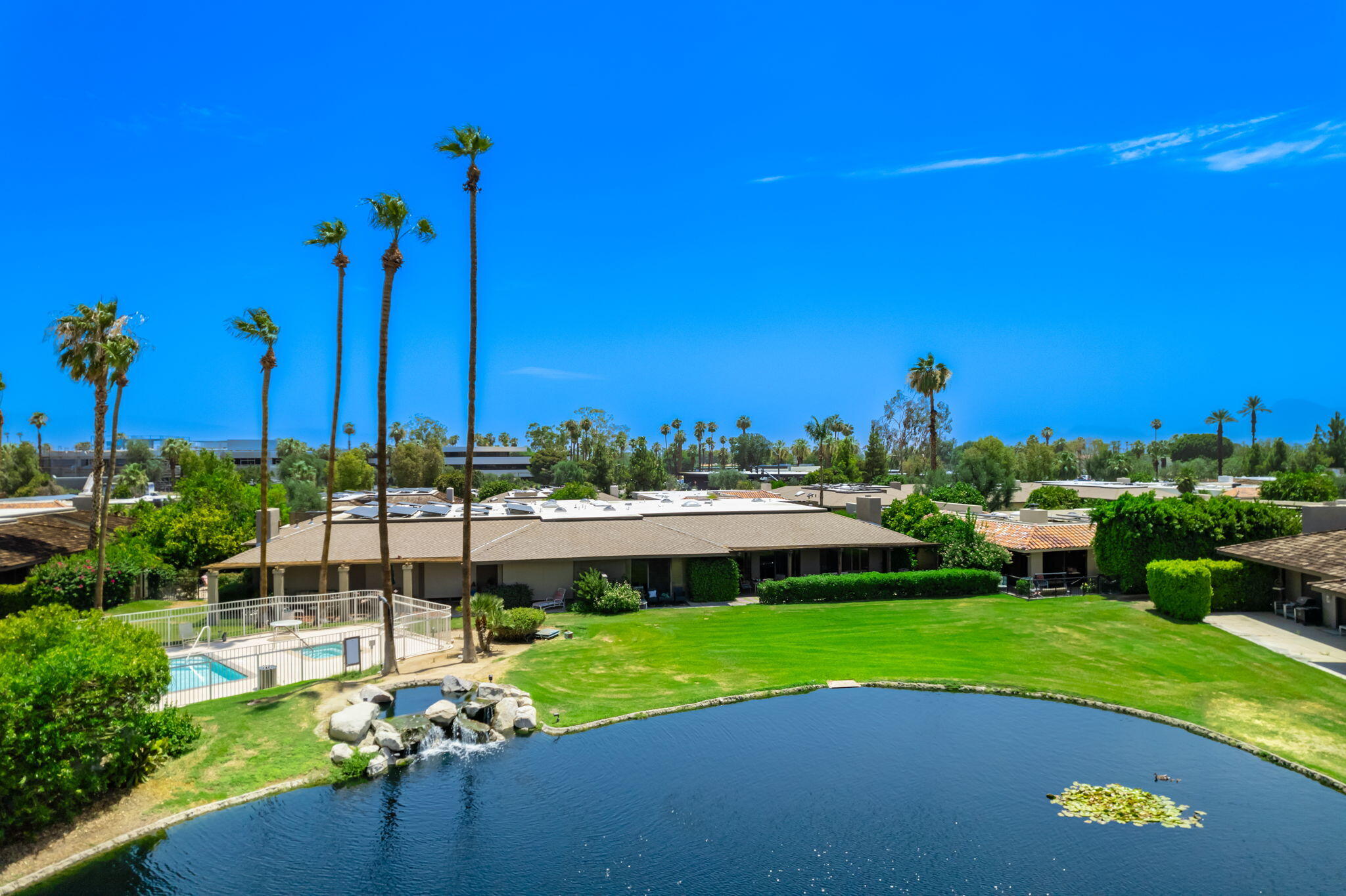 30 Colgate Drive Rancho Mirage, CA 92270 - Photo 36 of 40 Drone back to house across lake