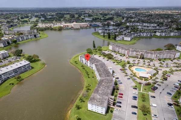 an aerial view of a city with lake view