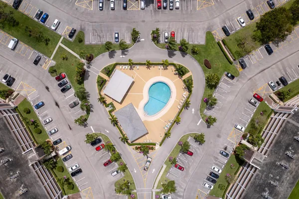 an aerial view of a house with a swimming pool