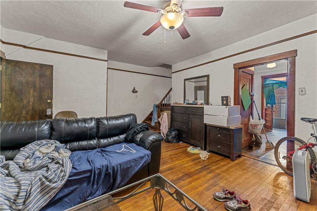 107 Ella Street McKees Rocks, PA 15136 - Photo 12 of 39 a living room with furniture and wooden floor