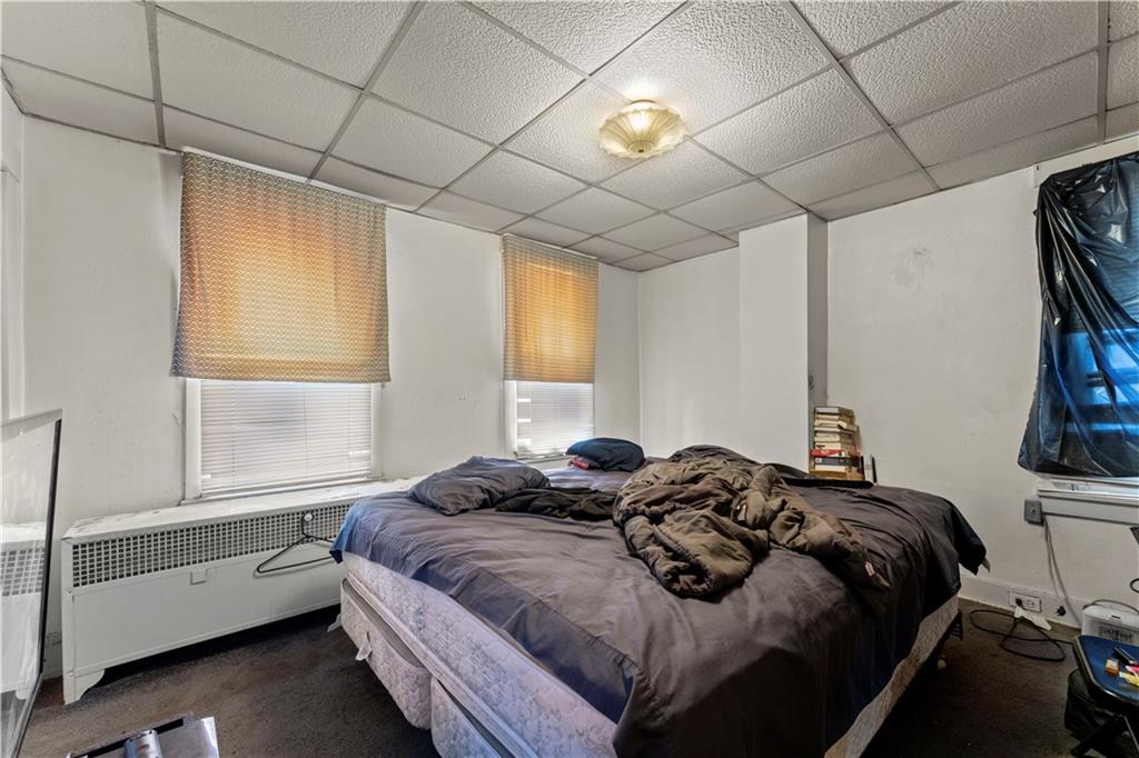 107 Ella Street McKees Rocks, PA 15136 - Photo 13 of 39 a bedroom with a bed and a window