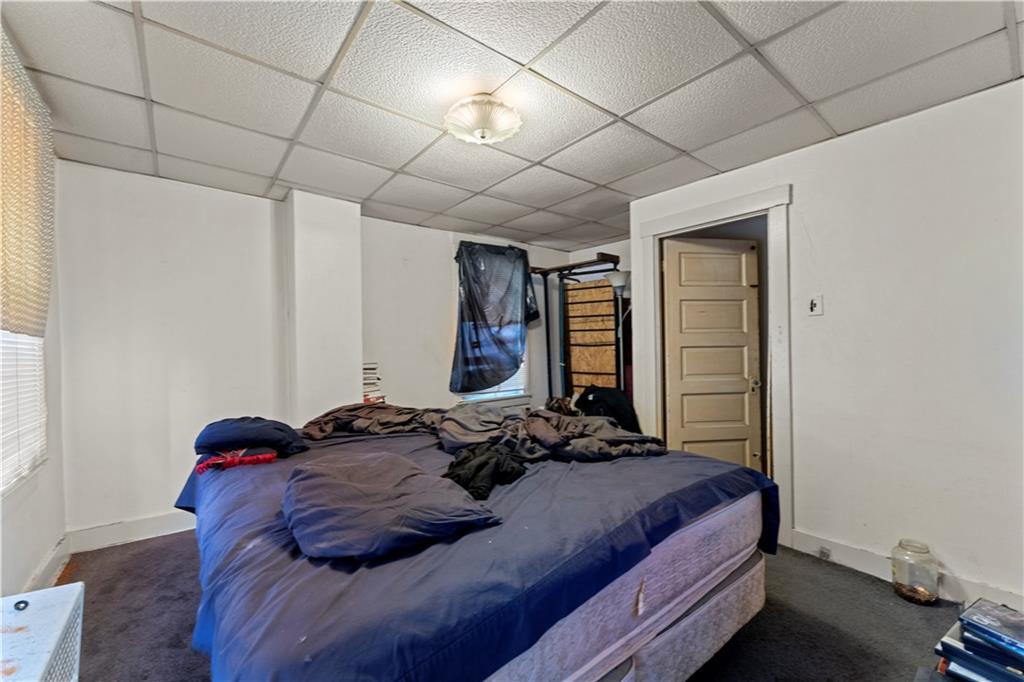 107 Ella Street McKees Rocks, PA 15136 - Photo 14 of 39 a bedroom with a bed and a window