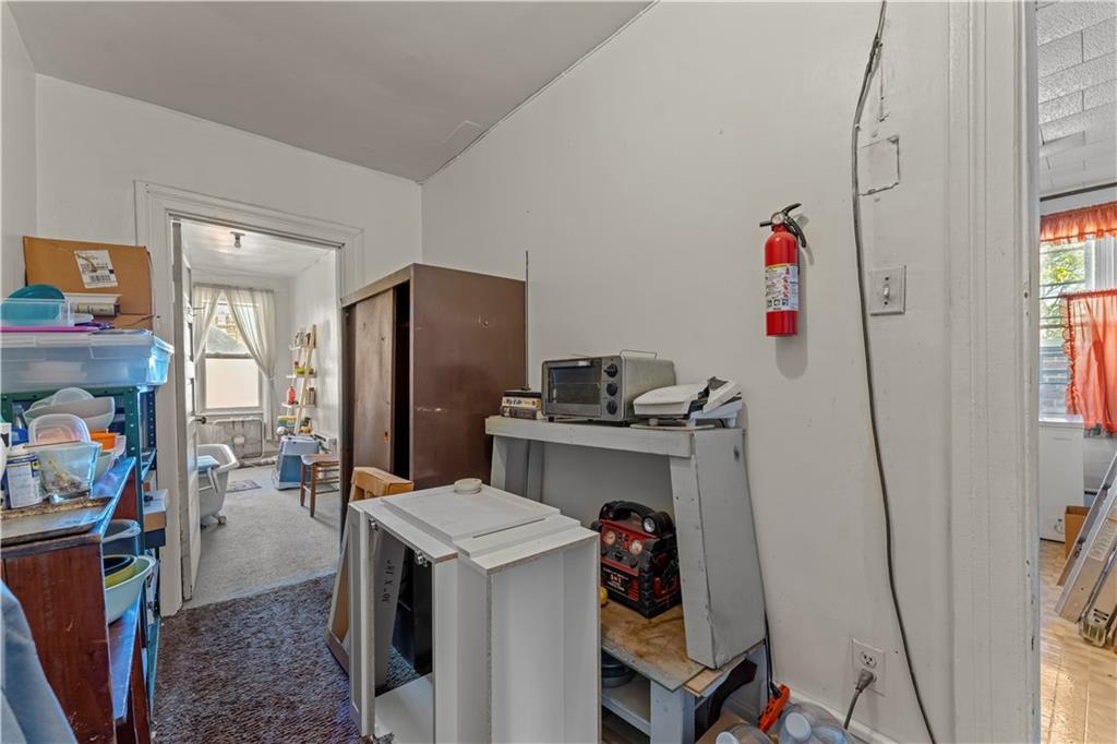 107 Ella Street McKees Rocks, PA 15136 - Photo 24 of 39 a kitchen that has a refrigerator and a stove