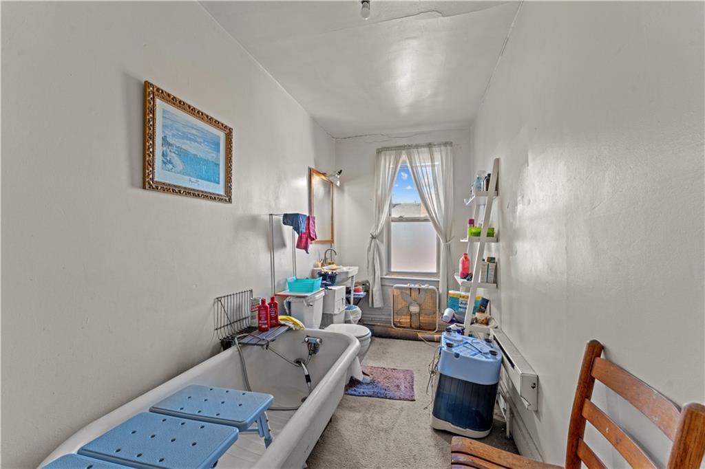 107 Ella Street McKees Rocks, PA 15136 - Photo 25 of 39 a room with furniture and a wooden floor