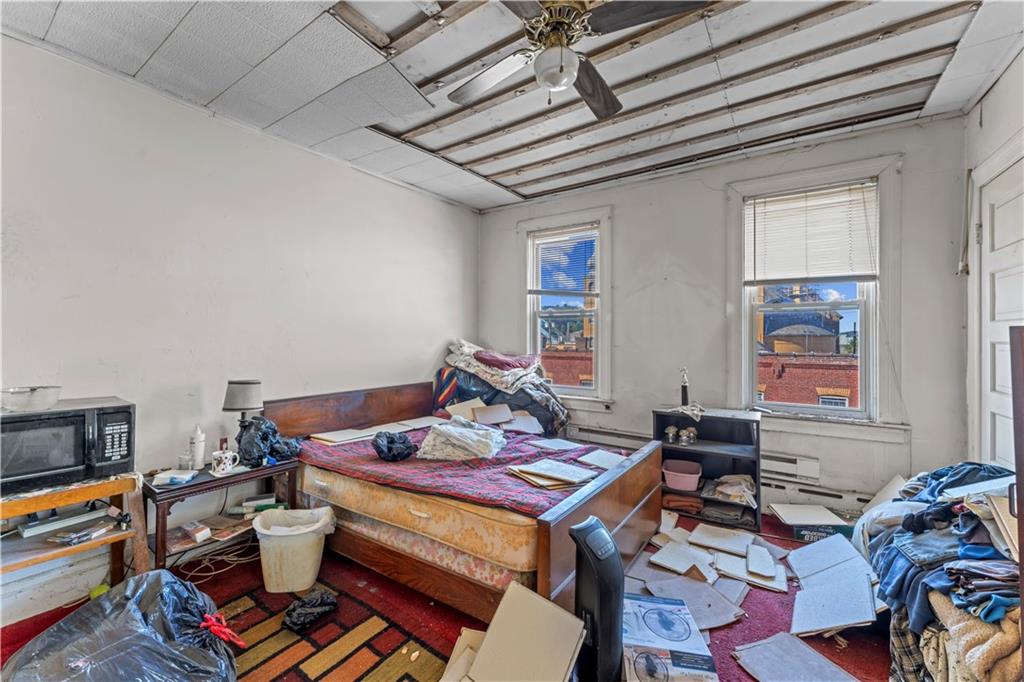 107 Ella Street McKees Rocks, PA 15136 - Photo 29 of 39 a living room with furniture a rug and a window