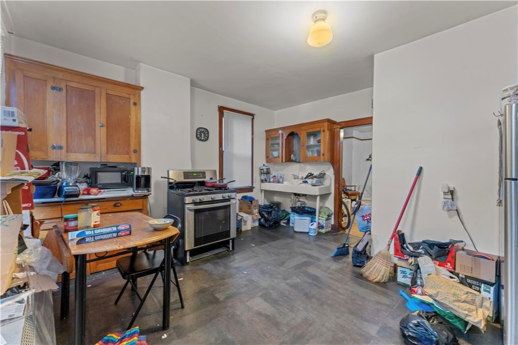 107 Ella Street McKees Rocks, PA 15136 - Photo 8 of 39 a view of a workspace with furniture and a flat screen tv